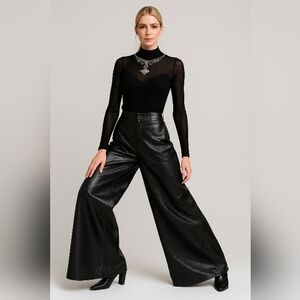 Black mesh long sleeve top with crust of Swarovski crystals. Pants Sold Separate